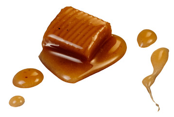 Sweet caramel candy and sauce, isolated on white with clipping path