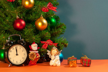 Christmas composition with a clock, a tree, Christmas balls with place for text