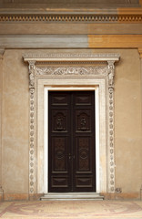 Fototapeta na wymiar Royal castle style wooden door, old opulence