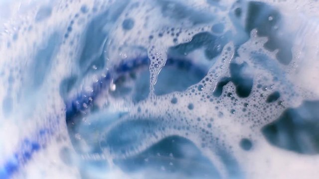 The washing machine washes things. Wet things in the foam and water spin in the washing machine.