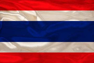 photo of the beautiful colored national flag of the modern state of Thailand on textured fabric, concept of tourism, emigration, economics and politics, closeup