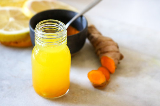 Close Up Of Turmeric (curcuma) Shot On A Marble Board