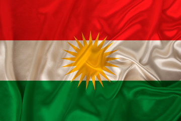 beautiful photo of the colored national flag of the modern state of Kurdistan on textured fabric,...
