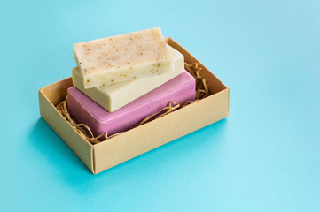 Set of handmade soap on a blue background. The concept of organic home cosmetics. Close up.