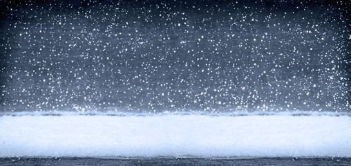 Christmas background with bright lights and snow.