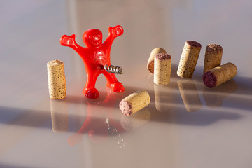 A corkscrew is a device in the form of a screw metal rod with a ring or handle at the end for...
