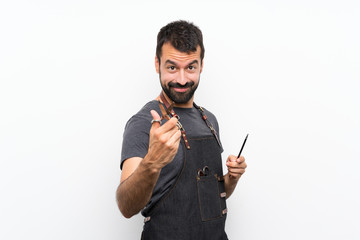 Barber man in an apron over isolated white background