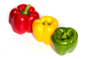 Three Red, Yellow, Green Peppers isolated on white background.