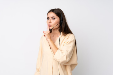 Young telemarketer woman over isolated white background doing silence gesture