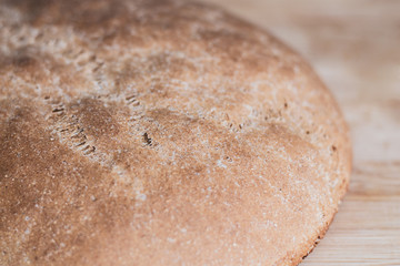 Large round rustic wheat bread. Crispy crust