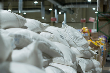 White bags with sugar in a wholesale store