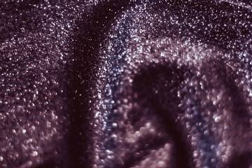 Purple holiday sparkling glitter abstract background, luxury shiny fabric material for glamour...