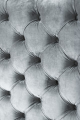 Silver luxury velour quilted sofa upholstery with buttons, elegant home decor texture and background