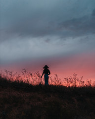 silhouette of woman on the sunset