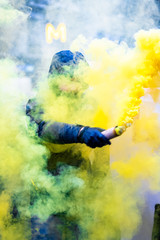 Protester with a torch and yellow smoke - 4/6