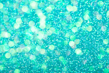 Mint festive background with sparkles in the bokeh. The concept of the celebration, the day of St. Valentine, New Year, birthdays, ceremonies, events, etc.