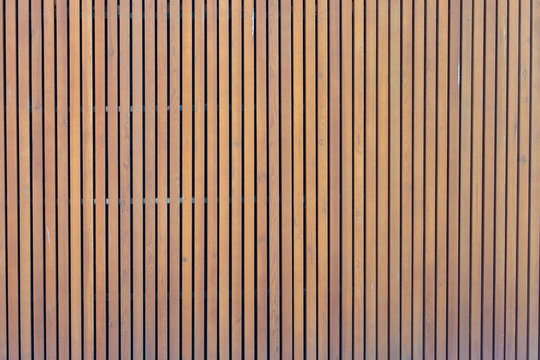 pattern of modern wall with vertical wooden panel, slats. background of wooden boards. wooden fence texture. wood plank with pattern for design