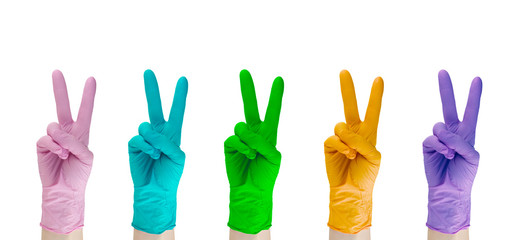 Set of multicolored rubber medical gloves isolated on white background.