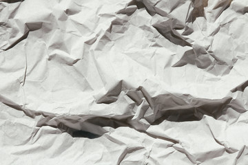 Crumbled brown paper texture background. Creases and scratches. Old letter template. Craft paper...