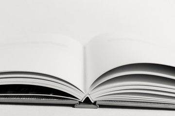 An open book on a table.