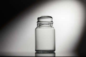 Empty glass jar on a white background