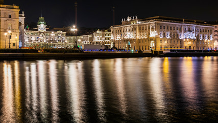 Fototapeta na wymiar Piazza Unità d'Italia at night. Mood lighting in Trieste. Italy