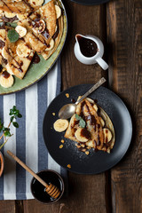 crepes with banana, chocolate-nut sauce and sweet croutons