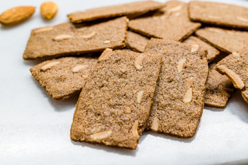 Crispy Almond Thins Cookies / Wafer with Nuts on Marble Board.