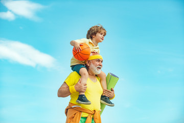 Motivation and sport concept. Sport exercise for kids. Grandfather and son doing exercises. I love...