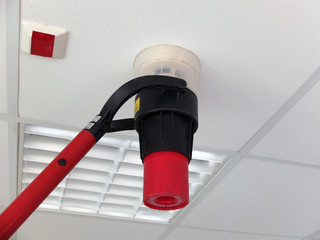 Narva, Estonia  03.04.2019 , Office room . Fire alarm system service. Professional Smoke Detector Tester 