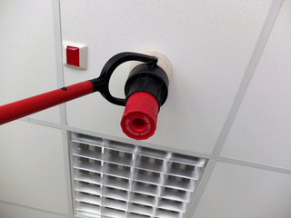 Narva, Estonia  03.04.2019 , Office room . Fire alarm system service. Professional Smoke Detector Tester 
