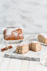 Cinnamon bread on a wooden Board. Delivery of fresh pastries.