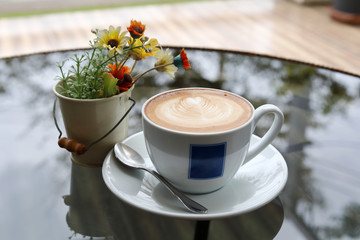 hot latte coffee drink put on table in cafe