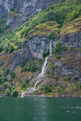 waterfall on edge of the Aurlandsfjord - unesco enlisted natural heritage site - in Norway