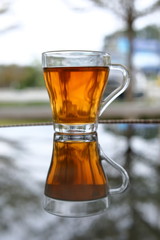 hot tea healthy drink put on glass table in the morning time