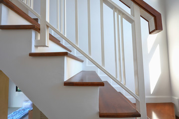 white steel balustrade on brown wooden stair interior decorated modern style of residential house