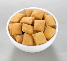 Shakkar pare Also Know as Shakkarpare, Shakarpare, Shakarpali, Shakkar Para, Sakarpara or Shankarpalli or shankar pale is a Snack Typically Made in India During Diwali - Image