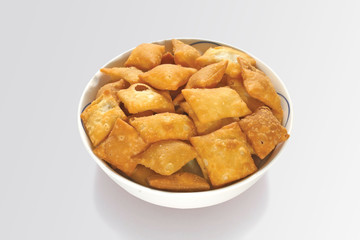 Shakkar pare Also Know as Shakkarpare, Shakarpare, Shakarpali, Shakkar Para, Sakarpara or Shankarpalli or shankar pale is a Snack Typically Made in India During Diwali - Image