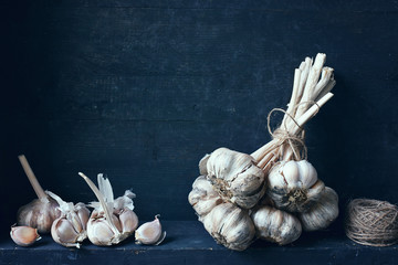 Fresh organic garlic bulb, tied together.