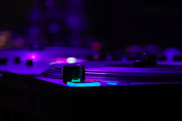 DJ vinyl players in dark nightclub, turntables