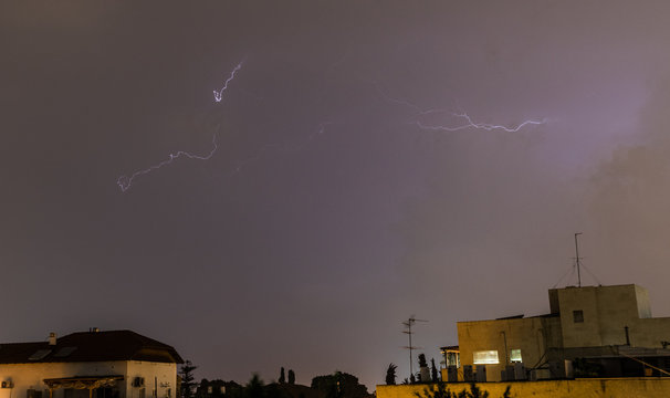 Distant Thunder Storm Across The Night Sky In An Urban Setting- Rehovot Israel