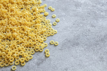 Anelli pasta close-up on a gray background.