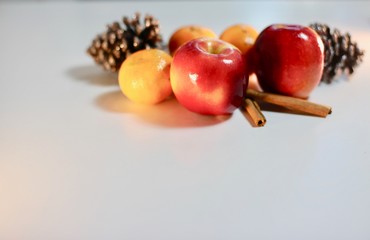 Tasty Christmas holiday fruit and spices on white background