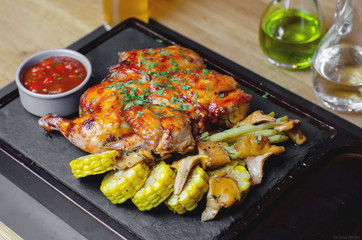 Grilled chicken with corn and sauces
