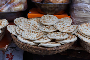 LHASA, TIBET / CHINA - August 1, 2019: Bowl with traditional tibetan flatbread - known as Balep...
