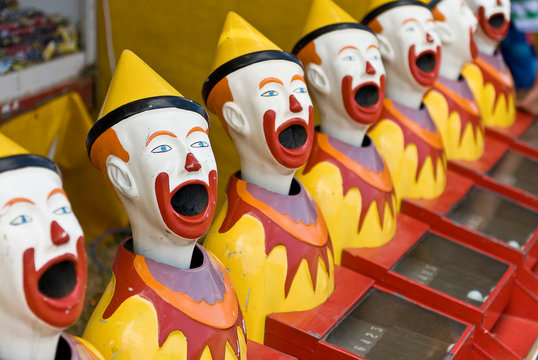 Brightly Colored Sideshow Clowns At A Circus..