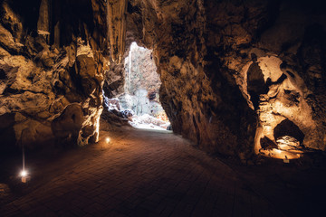 Beautiful Geological of Underground Cave and Sparkle Stalagmites, Nature Geology and Limestone Cavity Hidden Inside The Earth Ground. Deep Hall of Cavern With Natural Light, Adventure Activity Place