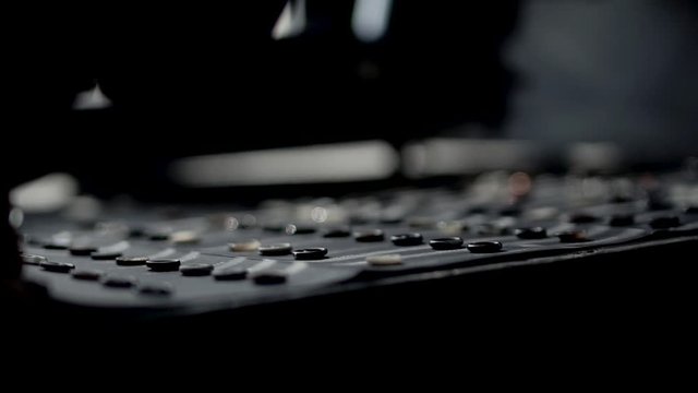 girl in jacket and a white shirt with hours and rings on drawn opens box with buttons