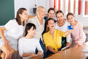 Students making selfie with teacher