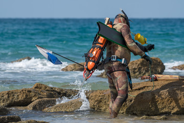 Fototapeta na wymiar Isolated close up of a single spear fisherman getting ready to enter the sea- Israel
